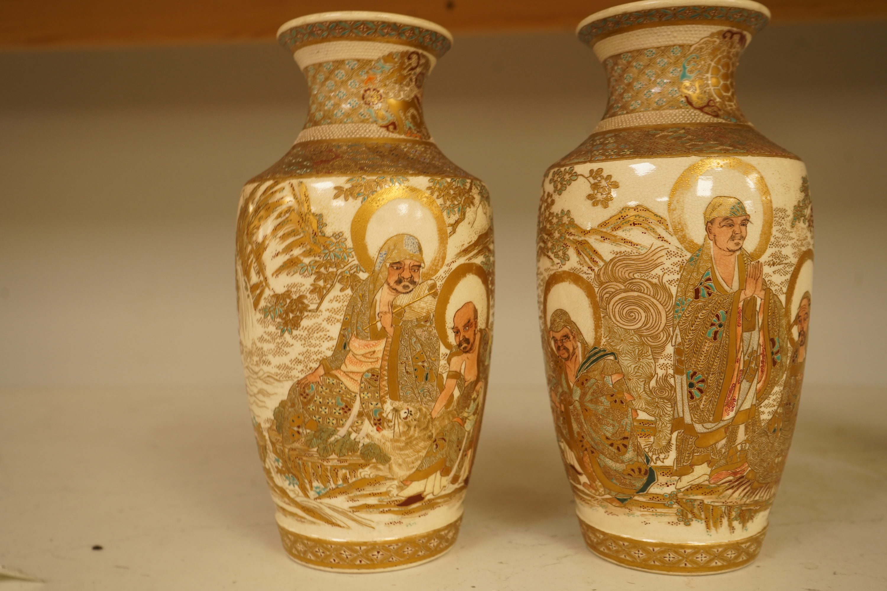 A pair of Japanese Satsuma ‘rakan’ vases, Meiji period, 21cm